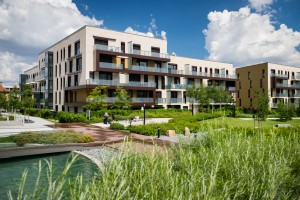 Public view of eco friendly block of flats in the green park with blue sky with few clouds